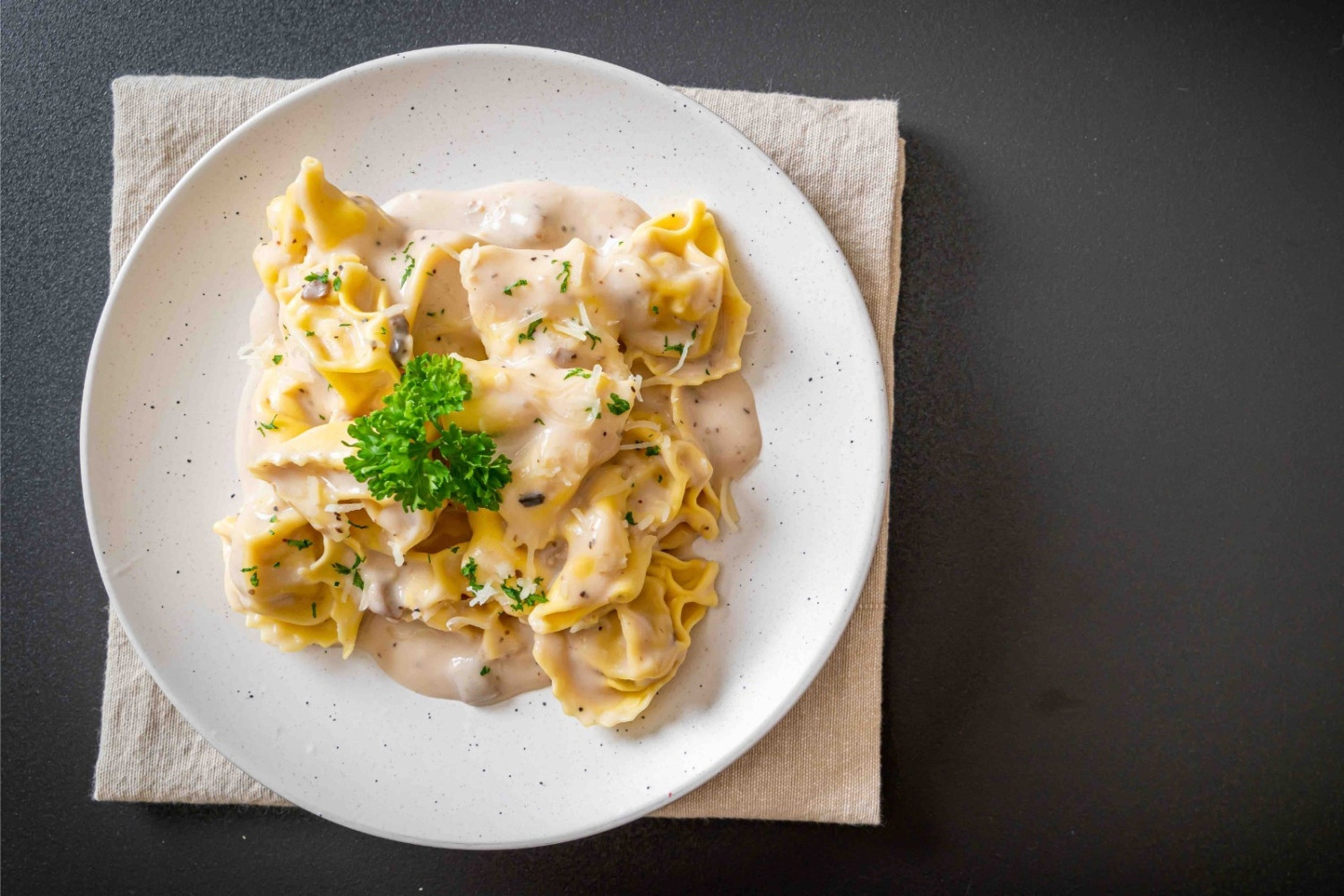 Handmade Potato Tortelli with Creamy Pecorino & Onion Emulsion